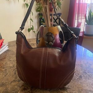 Brown leather Coach Hobo bag.